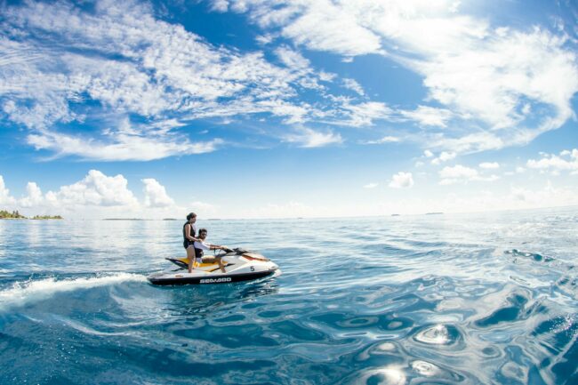 Guests riding on a jet ski in the open water Tourist arrivals in Maldives reach amazing numbers.